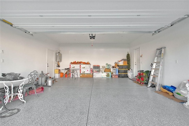 garage featuring a garage door opener and water heater