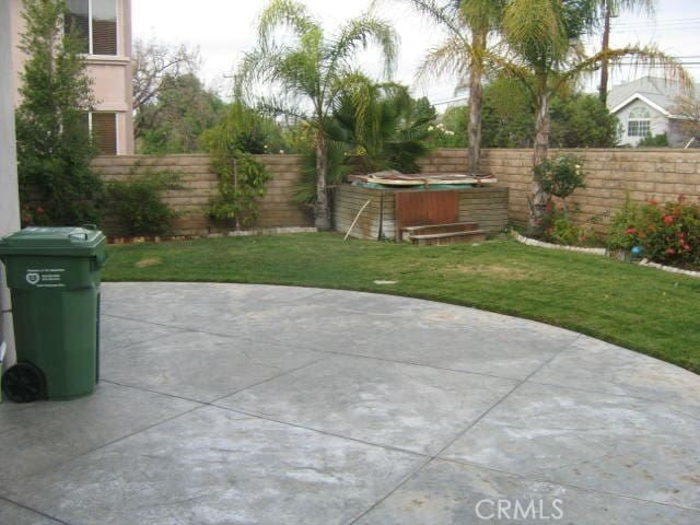 view of patio with a hot tub