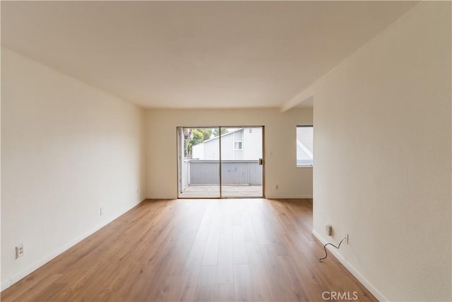 unfurnished room featuring light wood-type flooring