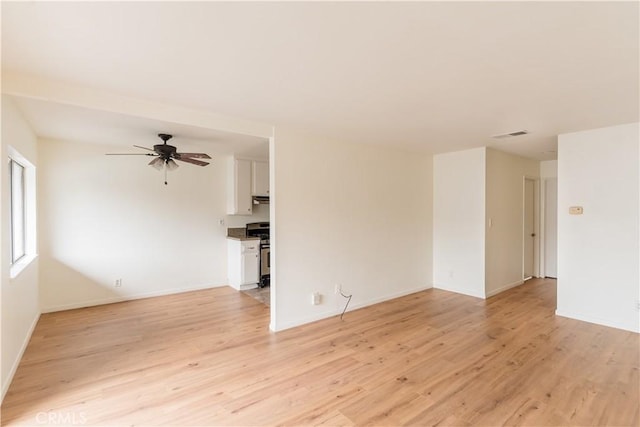 unfurnished room with ceiling fan and light hardwood / wood-style flooring