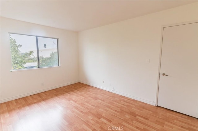 spare room featuring light hardwood / wood-style flooring