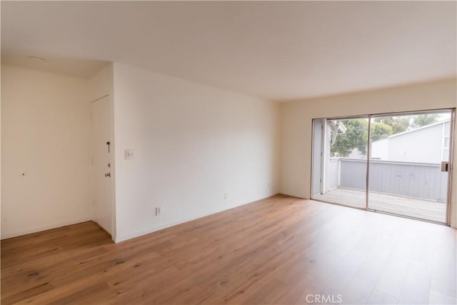 unfurnished room with light hardwood / wood-style floors