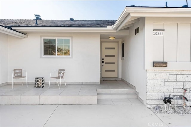 doorway to property with a patio