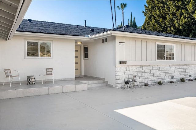 doorway to property featuring a patio area