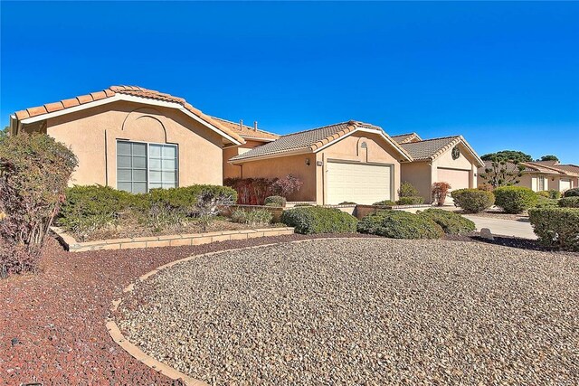 single story home featuring a garage