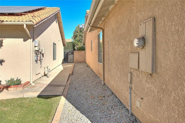 view of property exterior featuring solar panels