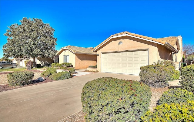 ranch-style home featuring a garage