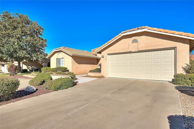 single story home with a garage