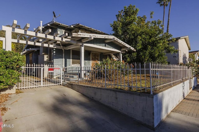 view of front of property with a pergola