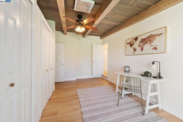 office space featuring ceiling fan, light hardwood / wood-style flooring, beamed ceiling, and wooden ceiling