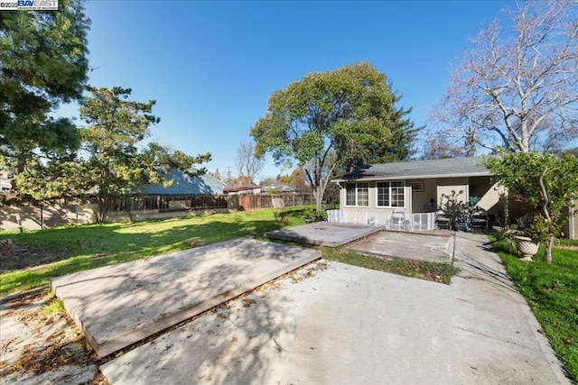 exterior space featuring a lawn and a patio