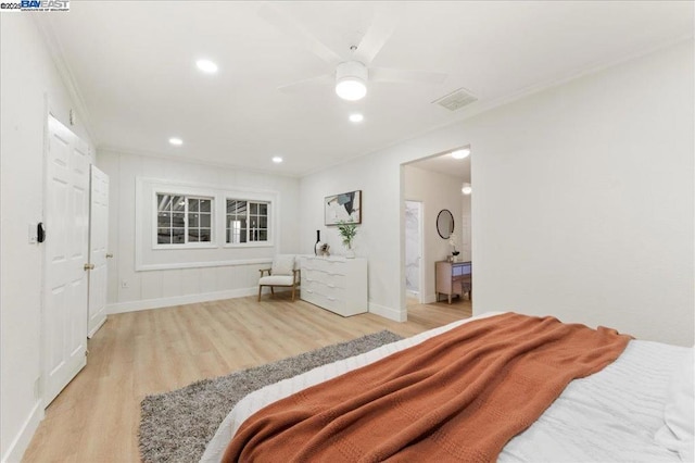 bedroom with ceiling fan, light hardwood / wood-style flooring, and ornamental molding