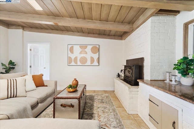 tiled living room featuring a wood stove, lofted ceiling with beams, and wood ceiling