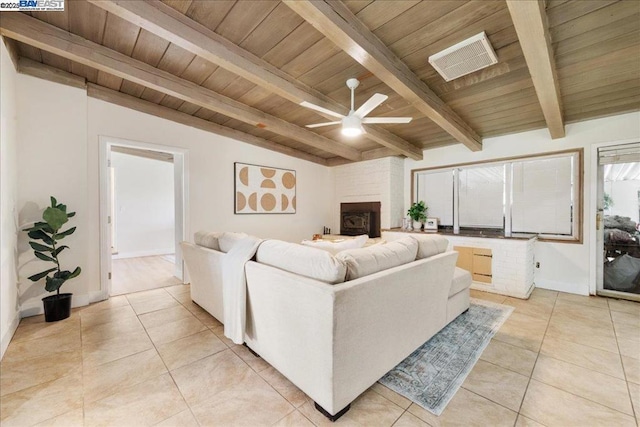 living room featuring light tile patterned floors, wood ceiling, ceiling fan, a large fireplace, and lofted ceiling with beams