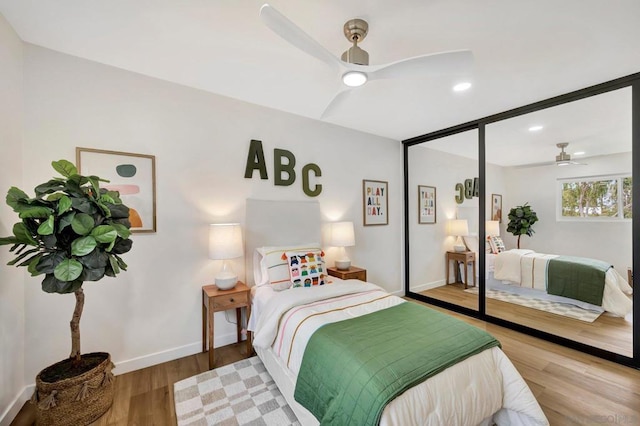 bedroom featuring hardwood / wood-style floors and ceiling fan