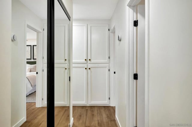 corridor featuring light hardwood / wood-style flooring