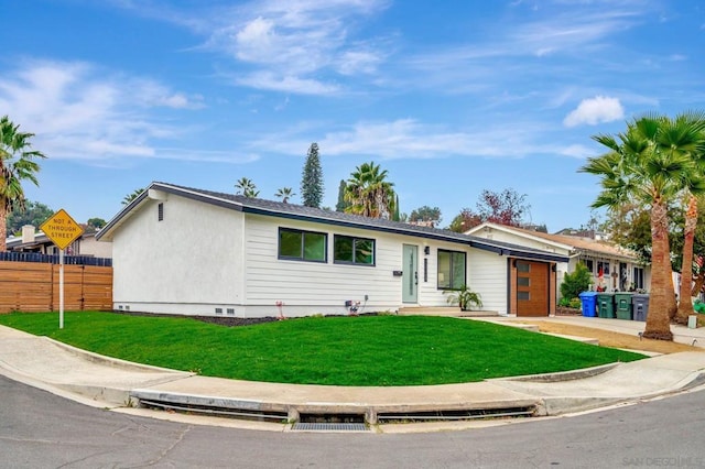 ranch-style home with a front yard