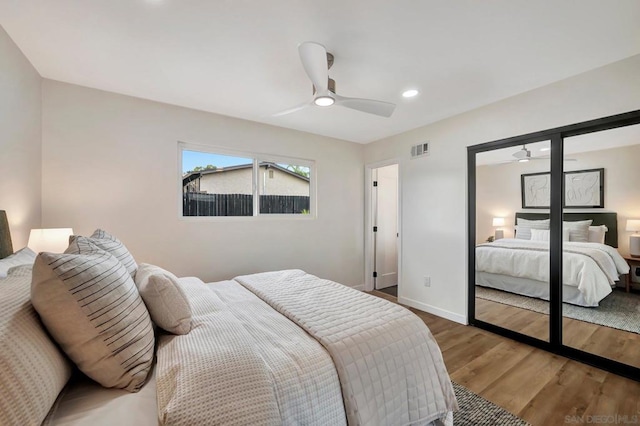 bedroom featuring hardwood / wood-style flooring and ceiling fan