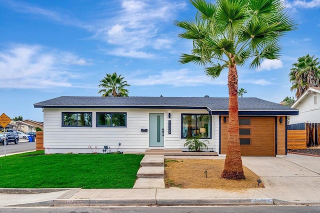 single story home with a front yard