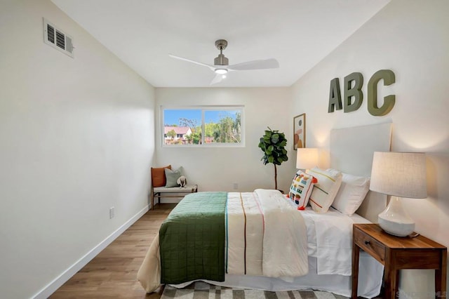 bedroom featuring hardwood / wood-style flooring and ceiling fan