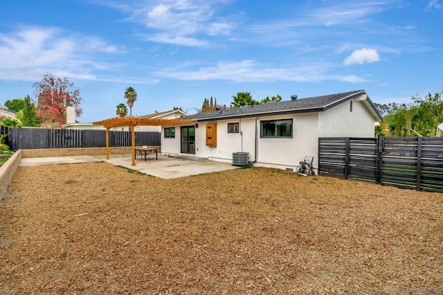 rear view of house featuring central AC and a patio area