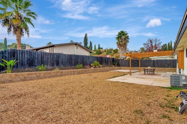 view of yard with a pergola, central AC unit, and a patio area