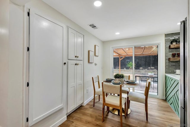 dining room featuring light hardwood / wood-style flooring