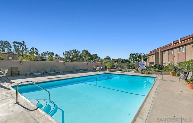 view of swimming pool featuring a patio