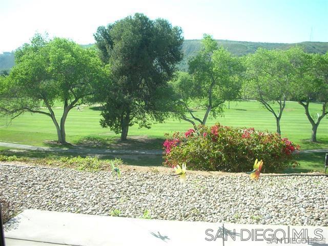 view of property's community featuring a yard