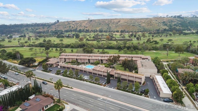 birds eye view of property with a mountain view