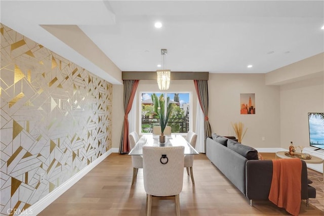 dining space with light hardwood / wood-style flooring