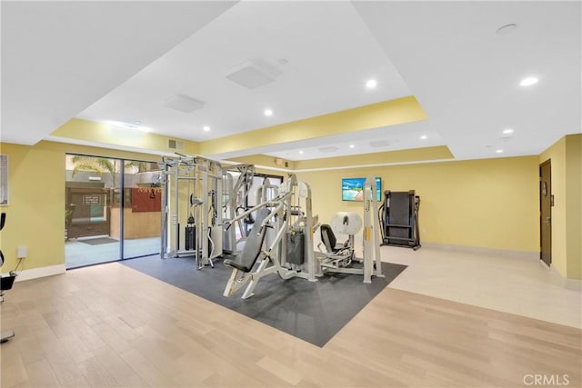 gym with wood-type flooring