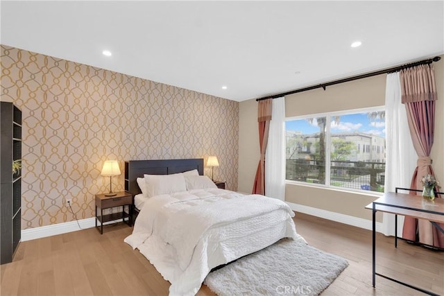 bedroom with hardwood / wood-style floors