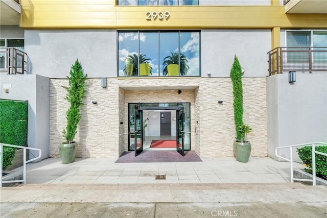 doorway to property featuring a patio area