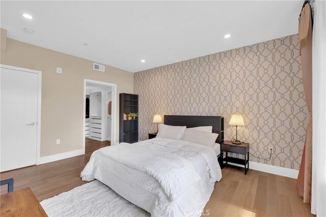 bedroom featuring hardwood / wood-style floors