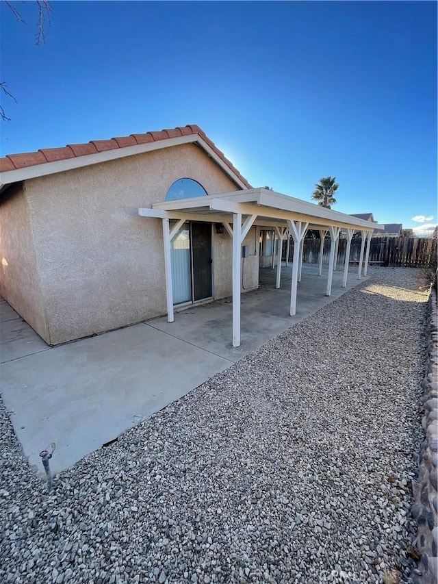 back of house with a patio