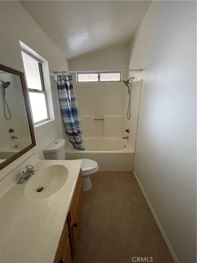 full bathroom with toilet, shower / bath combination with curtain, tile patterned floors, vaulted ceiling, and vanity