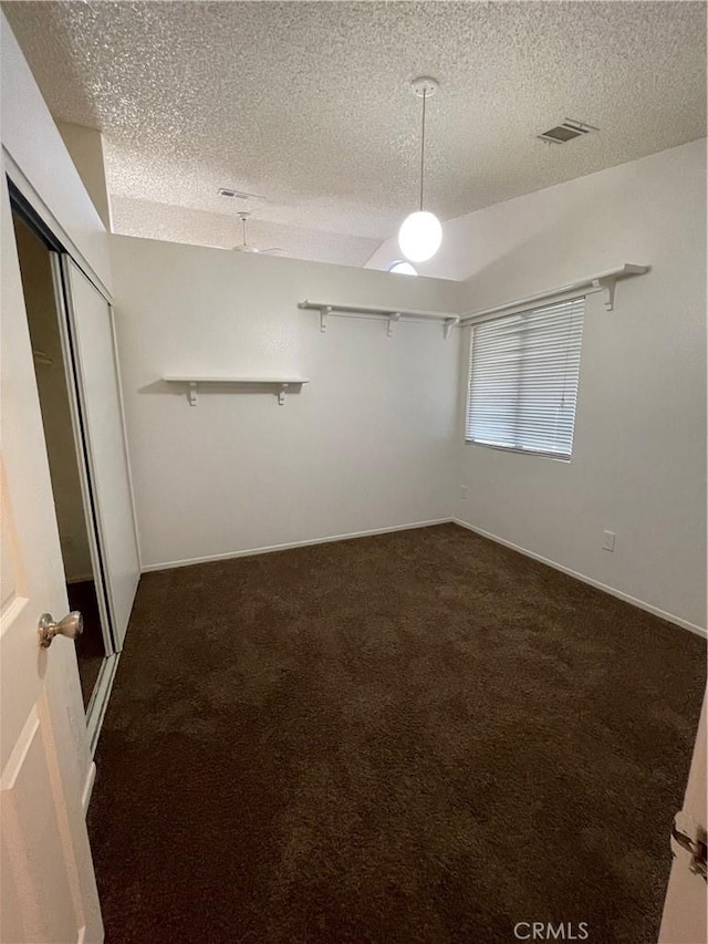 interior space with dark colored carpet