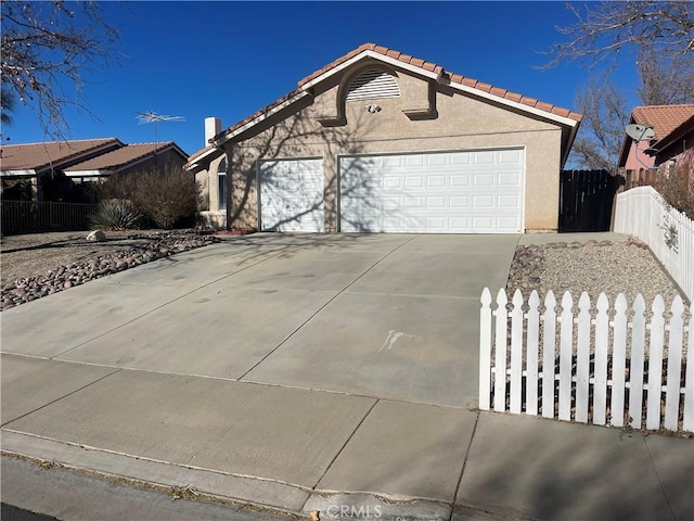 ranch-style house featuring a garage