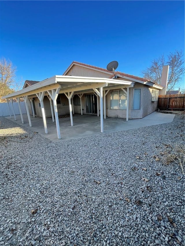 rear view of house featuring a patio