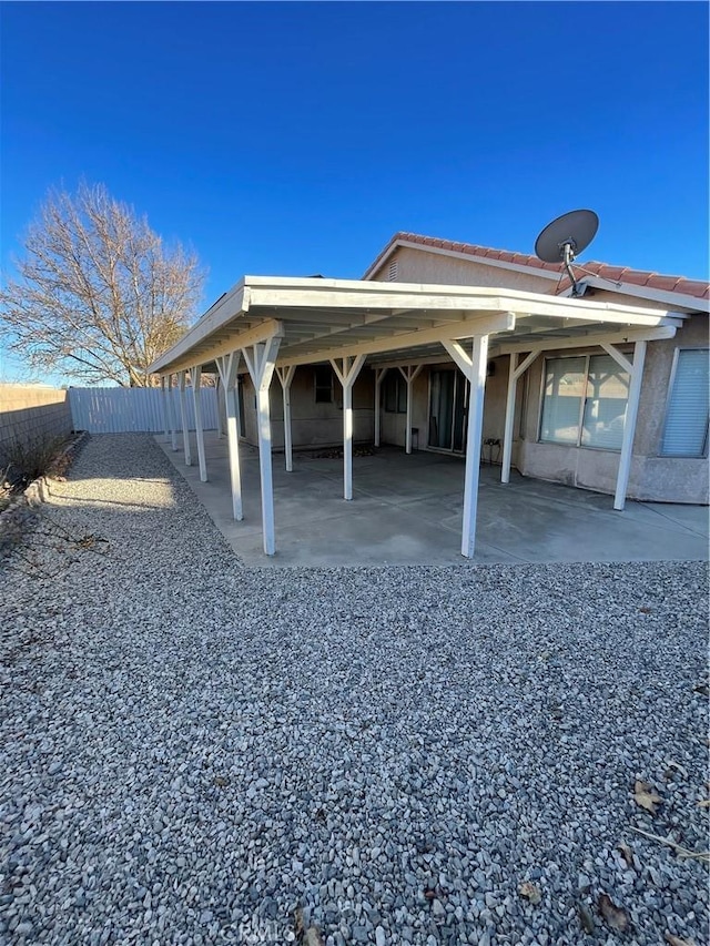 view of home's exterior featuring a carport