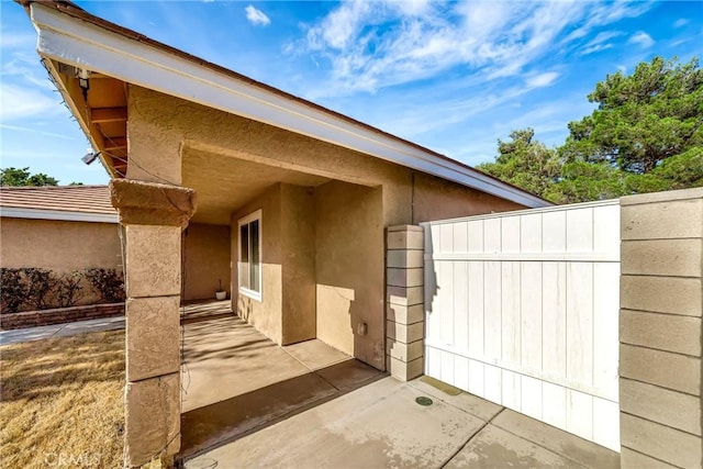 view of side of property with a patio area