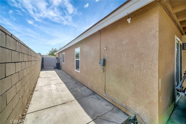 view of property exterior featuring a patio