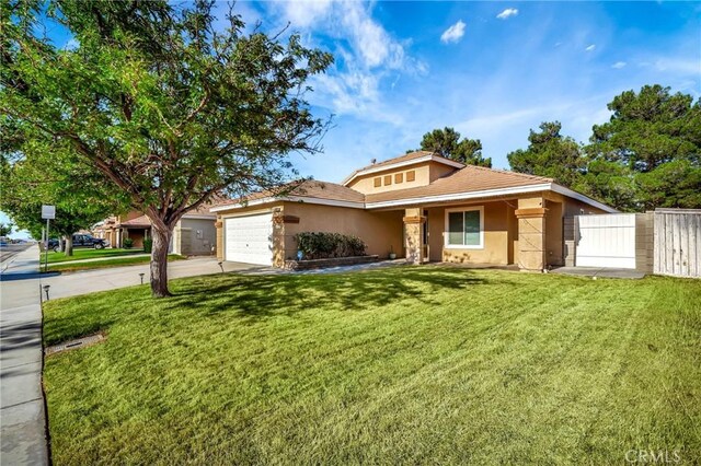 view of front of house with a front lawn and a garage