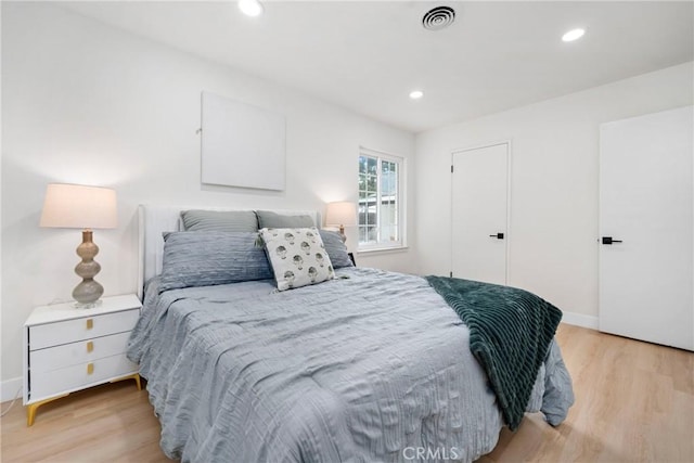 bedroom with light hardwood / wood-style flooring