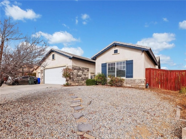 ranch-style house featuring a garage