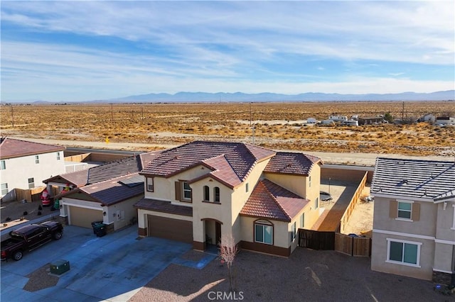 drone / aerial view featuring a mountain view