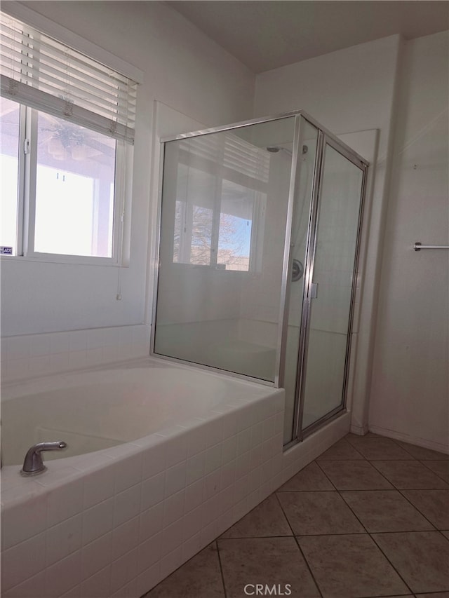 bathroom featuring tile patterned floors and an enclosed shower