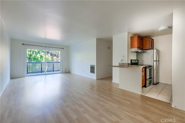 unfurnished living room with light wood finished floors