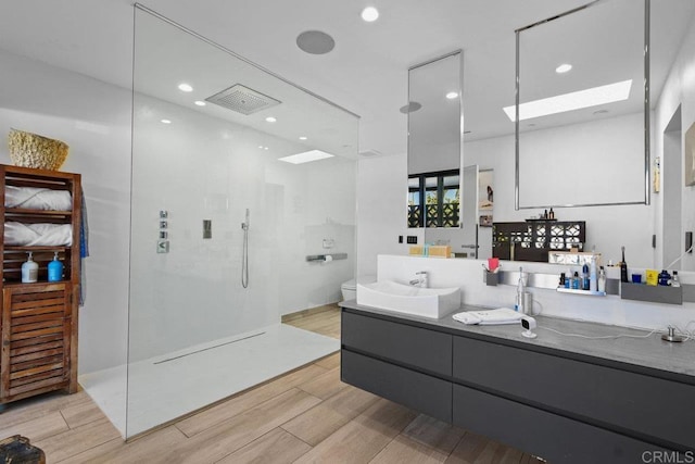 5455 Toyon Rd, San Diego, CA 92115 - full bath with walk in shower, double vanity, wood finished floors, and recessed lighting